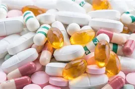 Prescription medication pills arranged for safe daily regimen tracking
